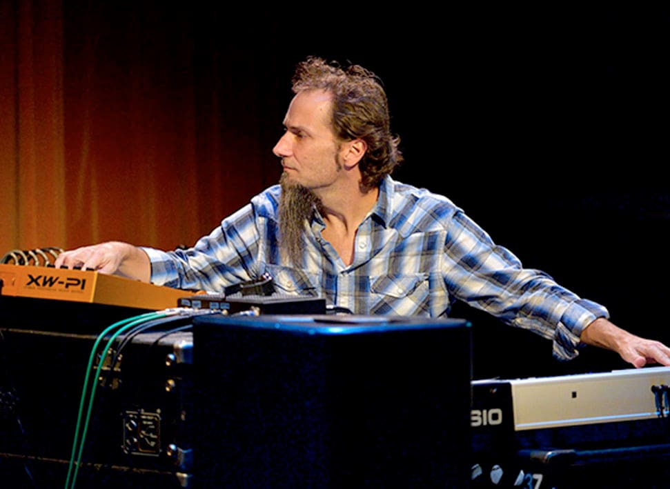 Steve Weingart playing a Privia PX-5S digital piano and XW-P1 synthesizer on stage