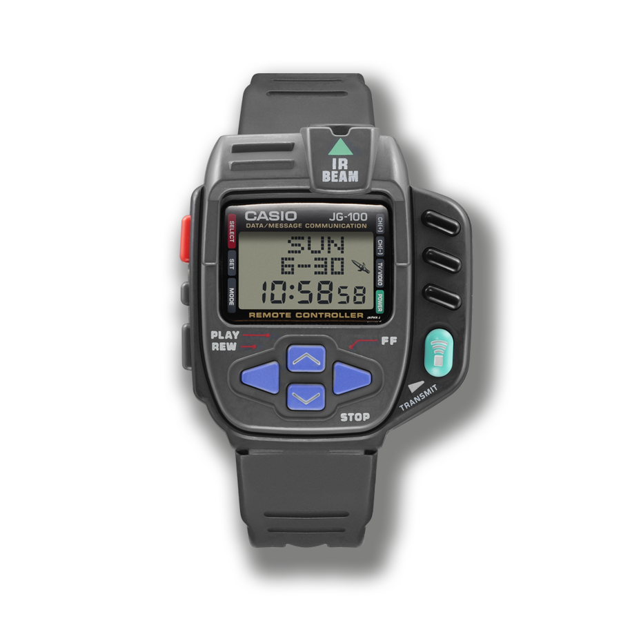 Die rechteckige JG-100 Uhr in grau mit kleinem digitalen Display und vier Cursor-Buttons in lila unterhalb der Anzeige.