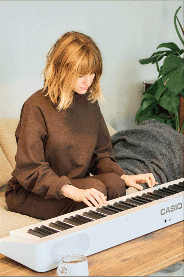 Model Camille Châtelet from Paris plays her white Privia. The picture links to her Life with Privia page.