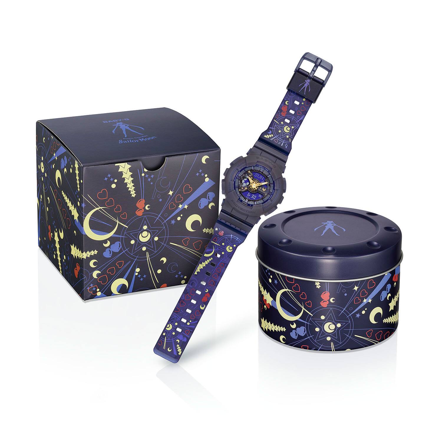 Several illustrated hearts and crescent moons on the round metal packaging and paper outer packaging of the Baby-G BA-110XSM-2A