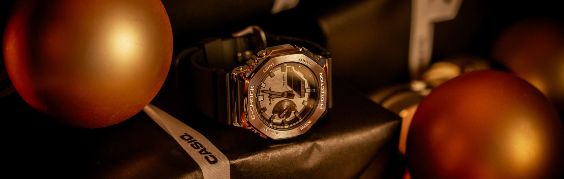 G-SHOCK watch GM-2100-1A on a pile of christmas presents