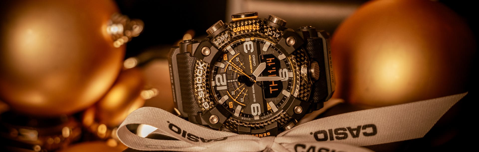 G-SHOCK watch GG-B100Y-1A on a pile of christmas presents