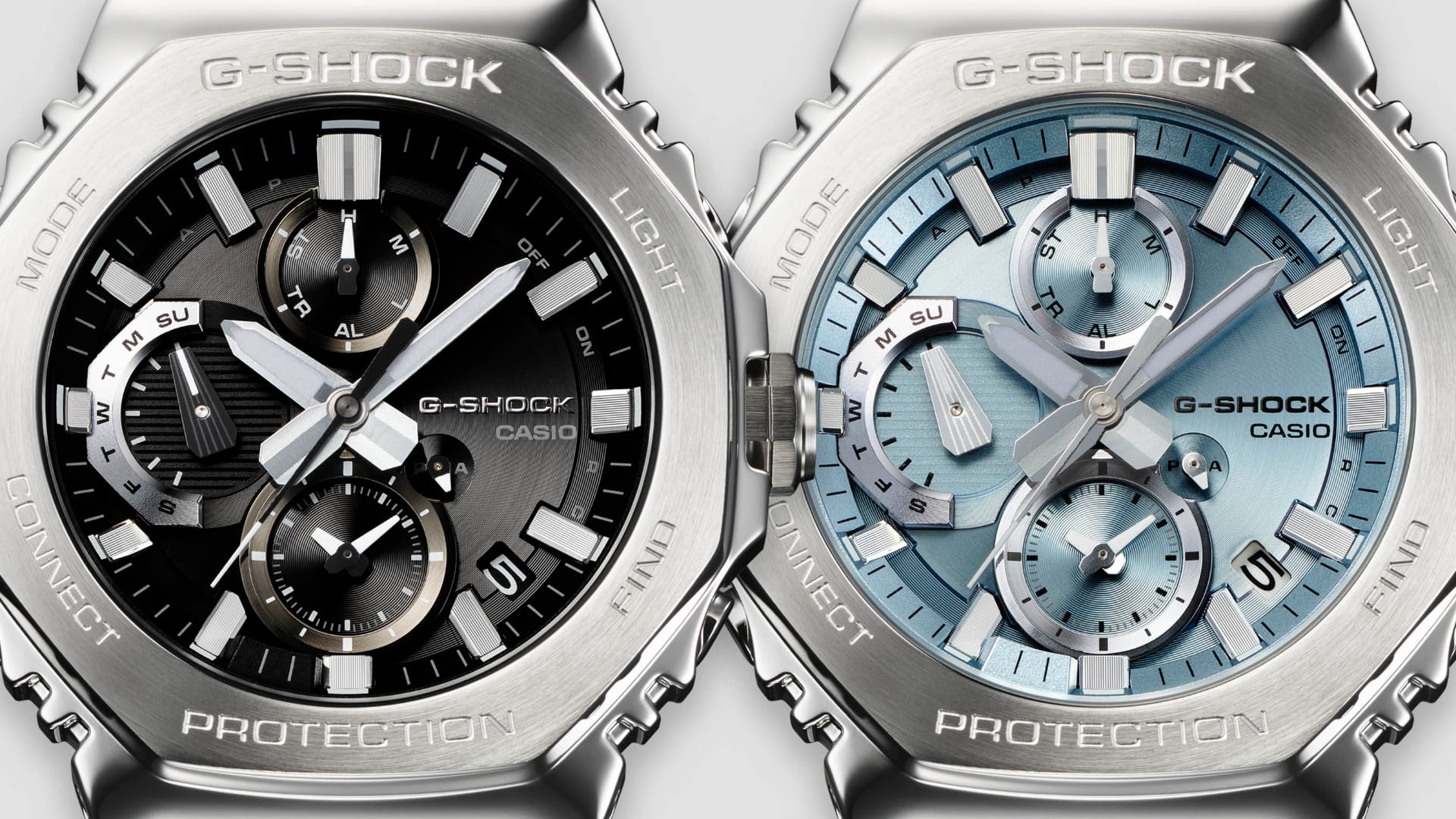 Close-ups of the dials of the G-Shock models GMC-B2100D-1A and GMC-B2100AD-2A.