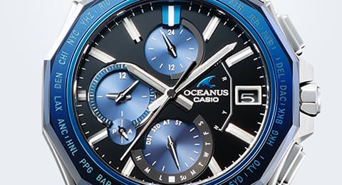 Close-up of a black dial. Additional functions, such as the display of the days of the week, are highlighted in blue.