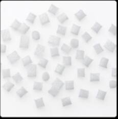 Detailed view of glass fibre reinforced plastic pellets in white