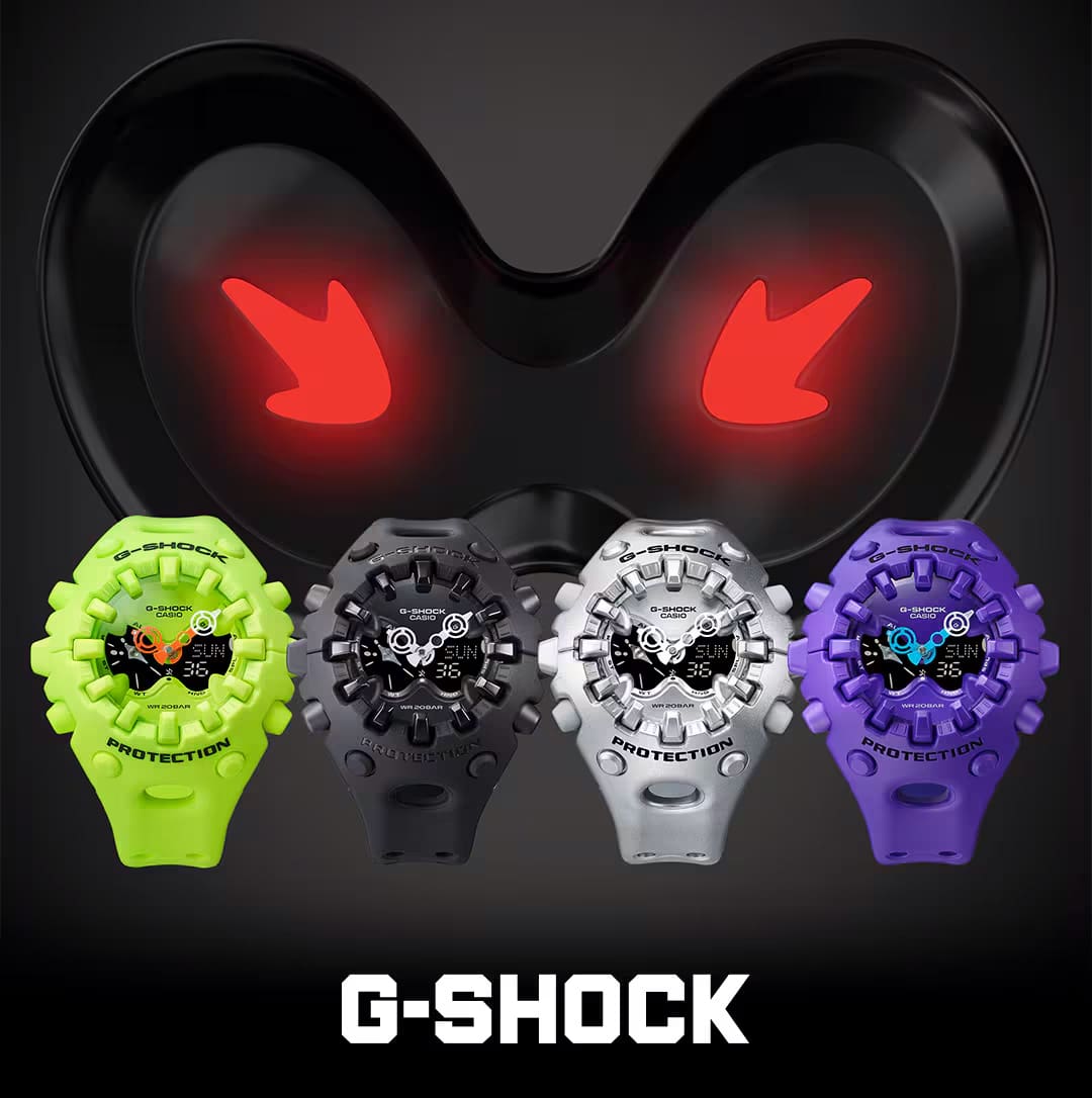 Quatre modèles de montres « GA-V01 » avec un grand boîtier rond et encombrant et un affichage analogique en jaune fluo, noir, argent et violet.