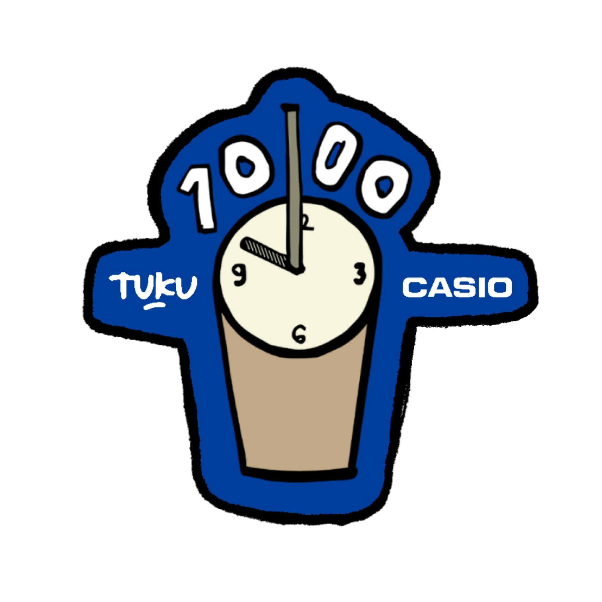 A man in a white shirt wears the CASIO Timeless Collection watch with square digital display and silver-coloured strap and looks through the lens of a reflex camera