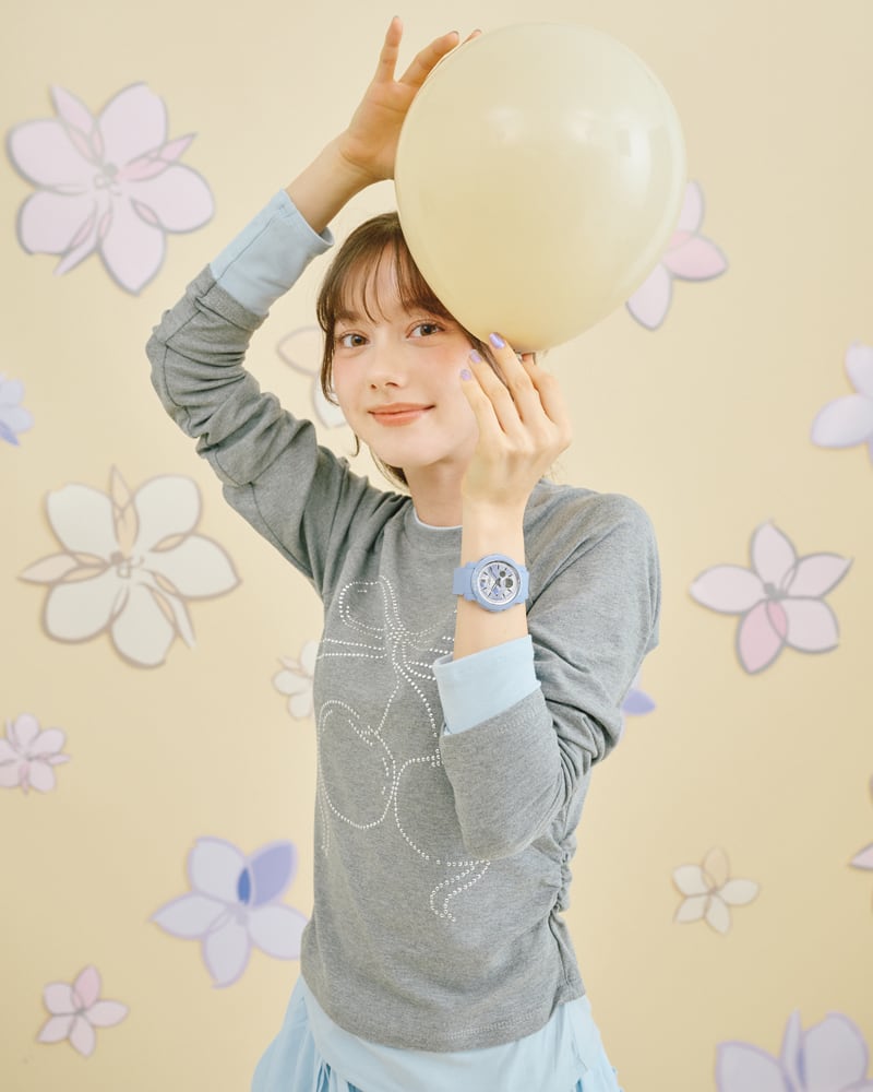 Image of a woman wearing BGA-290FL-2A holding a balloon