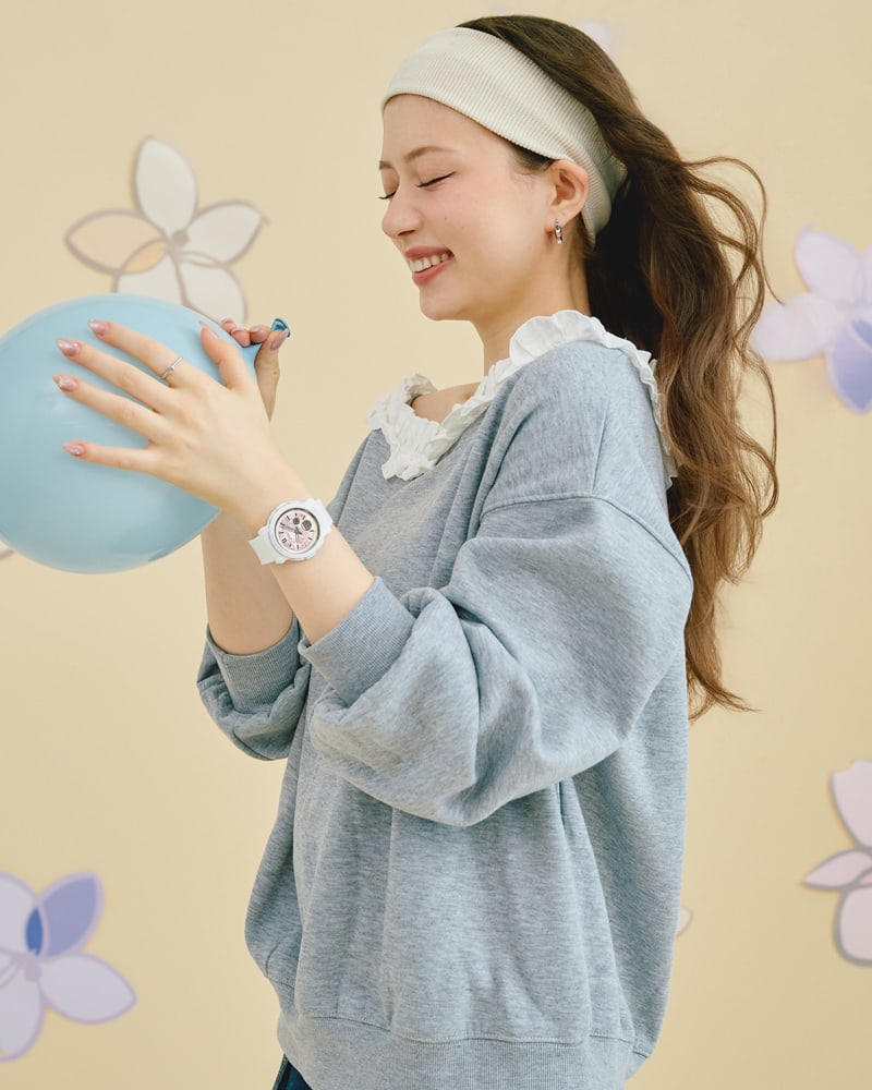 Image of a woman wearing BGA-290FL-7A with a bandana wrapped around her head holding a balloon