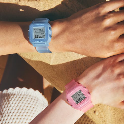 Close-up of the wrists of two women wearing BGD-10KG watches