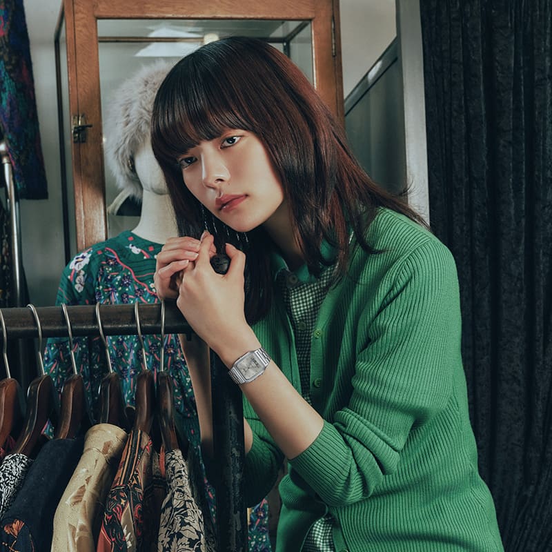 This is a photo of a person styling an outfit with the G-SHOCK AQ-230A-7AMQY in a fashion setting.