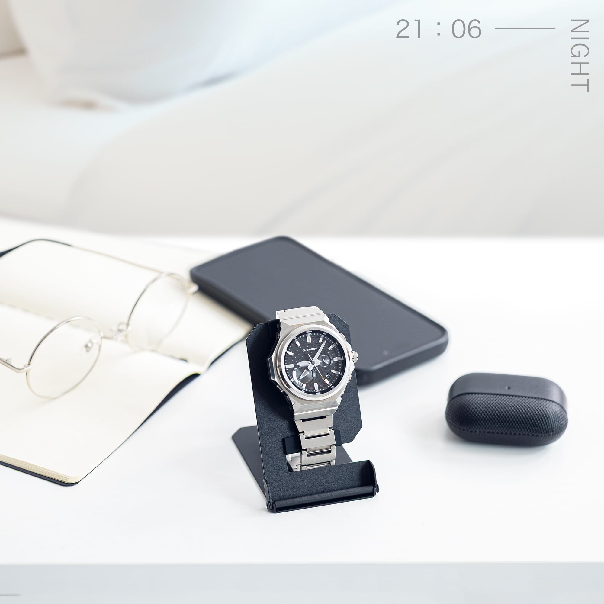  A imaeg of showing a portable watch stand on the bedside table