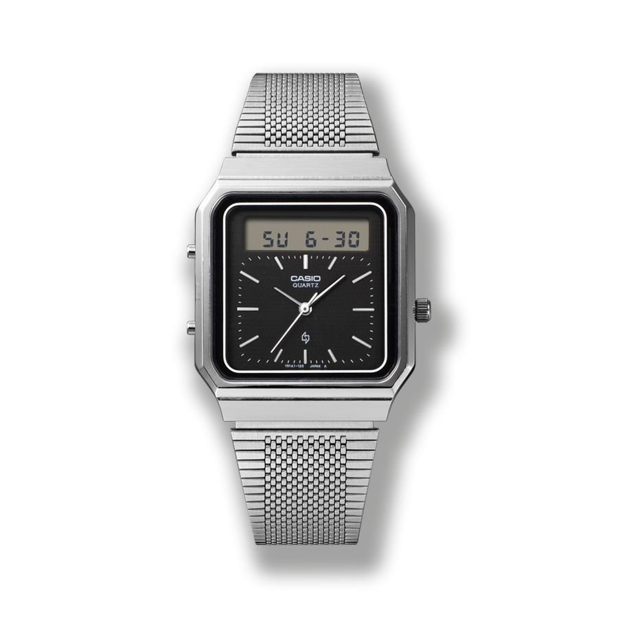 L'orologio da polso AT-550 di CASIO con quadrante analogico nero, piccolo display digitale della data e cinturino argentato a maglia.