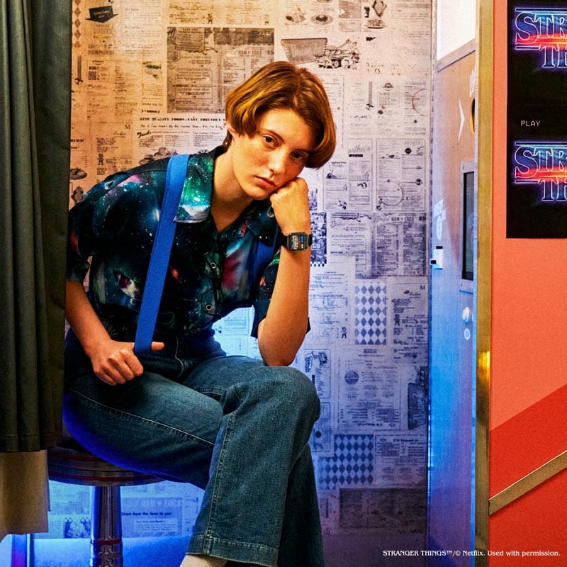 Model dressed like Netflix Stranger Things character with  Casio x Netflix Stranger Things Collaboration digital watch model