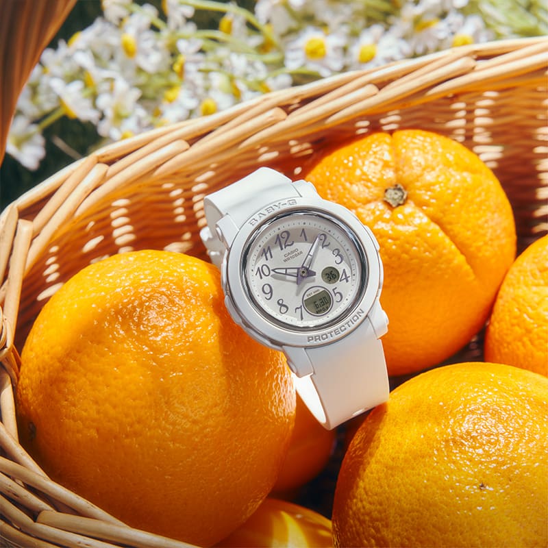 Close-up of a BGA-290SA-7A watch with citrus fruits in the background