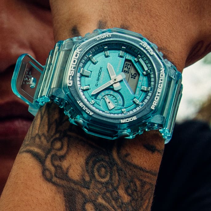 Het turquoise G-Shock GMA-S2100-polshorloge. De teaser linkt naar de overzichtspagina van de GMA-S2100-serie.