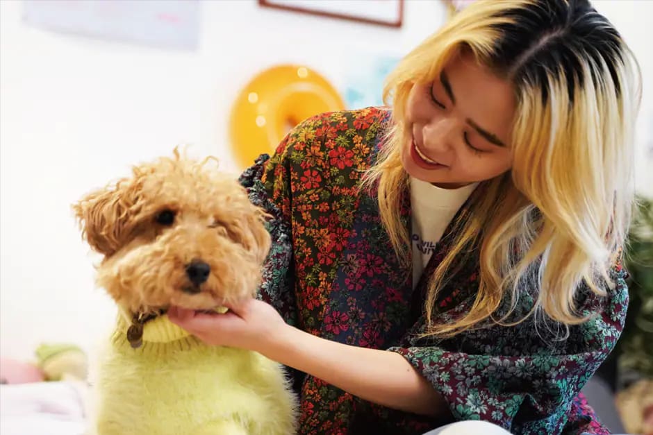 An image of Hayano Alex, the Props Stylist, and a dog