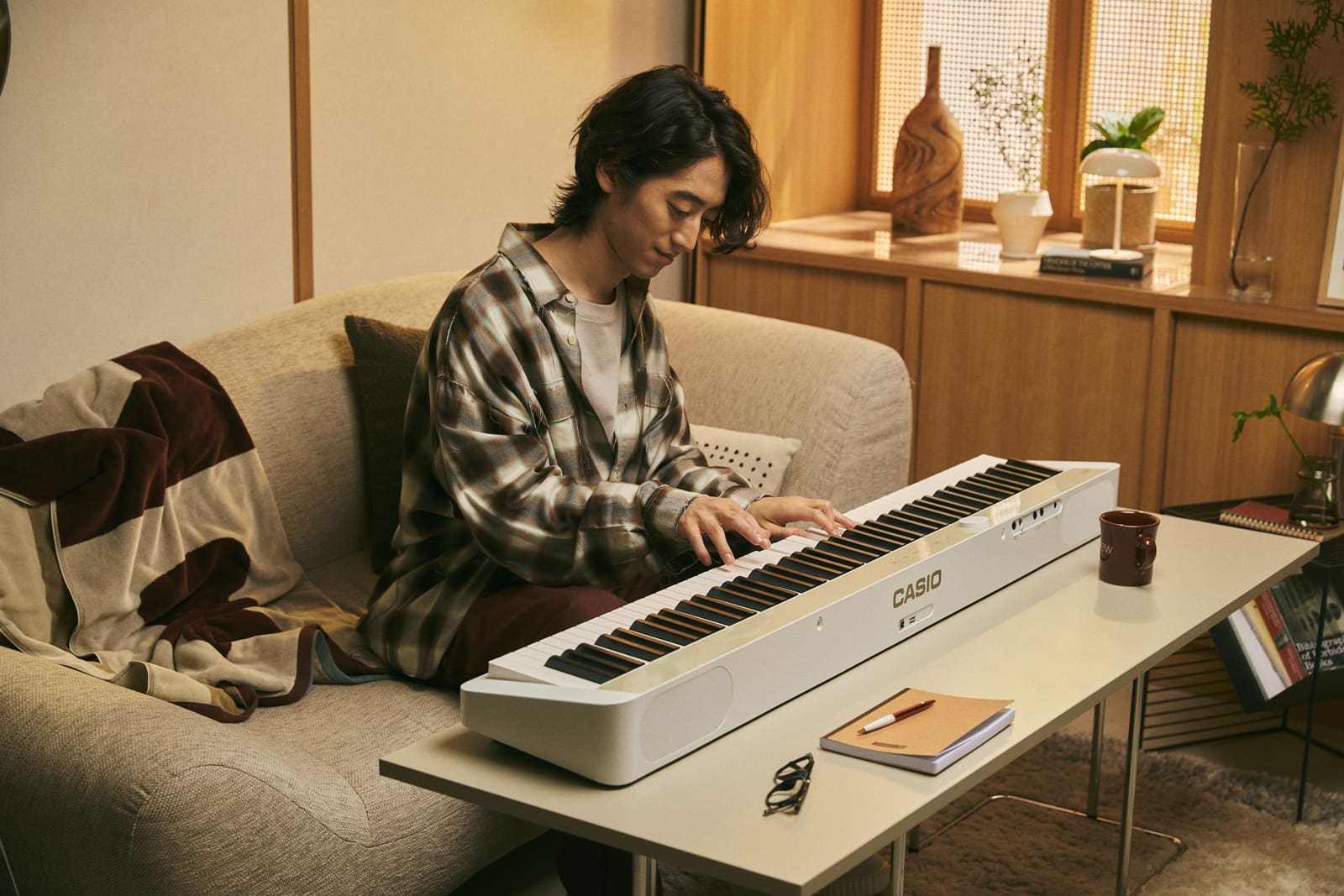 An image of Hayato Sumino playing the Privia piano