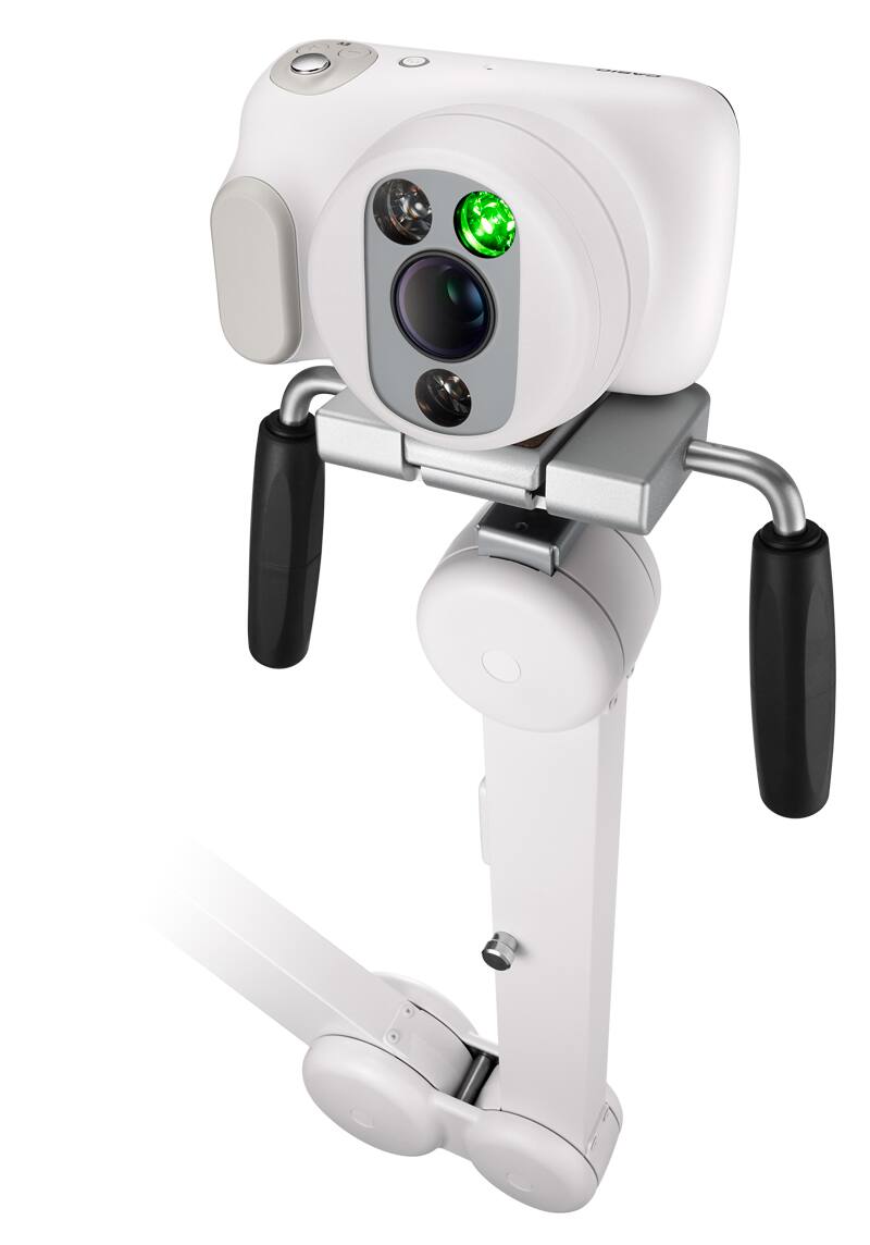 A câmara ginecológica "DZ-C100" em branco com lente grande num suporte branco