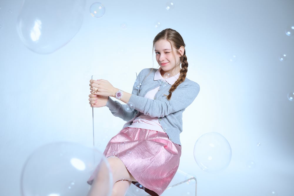 Bust-up photo of a girl seated with the BA-110PS-7A on her wrist.