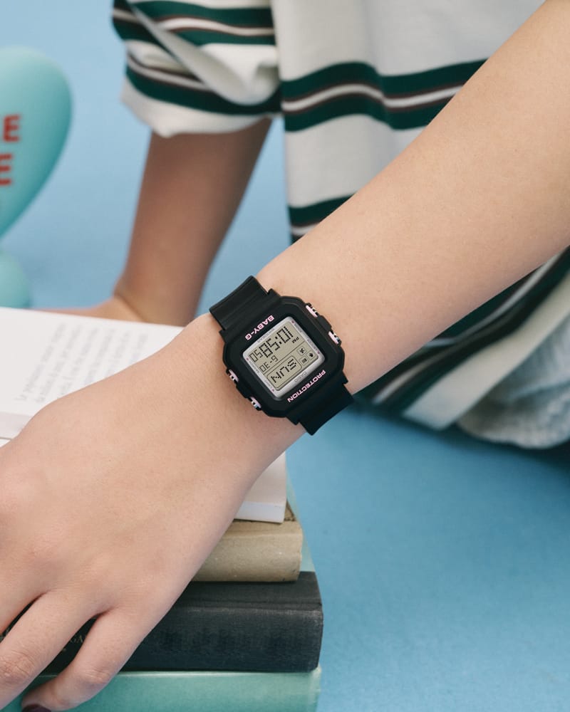 BGD-10KH-1on the wrist of a girl wearing white clothing.