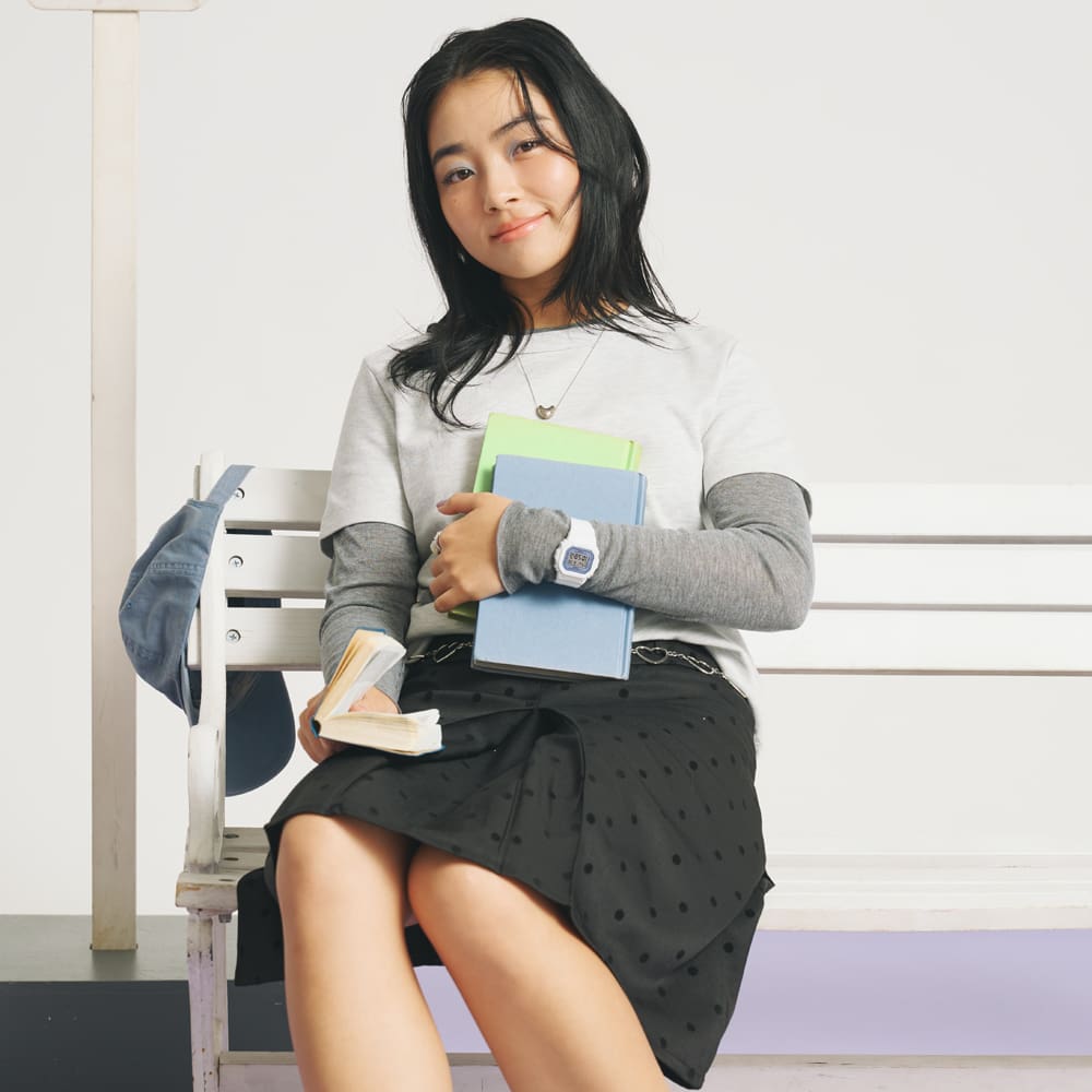 A full-body photo of a woman wearing the BGD-565SC-2B on her wrist