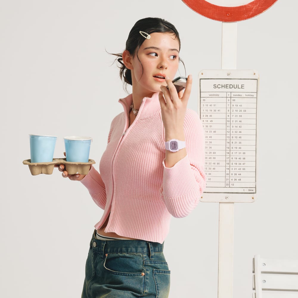 A full-body photo of a woman wearing the BGD-565SC-4B on her wrist