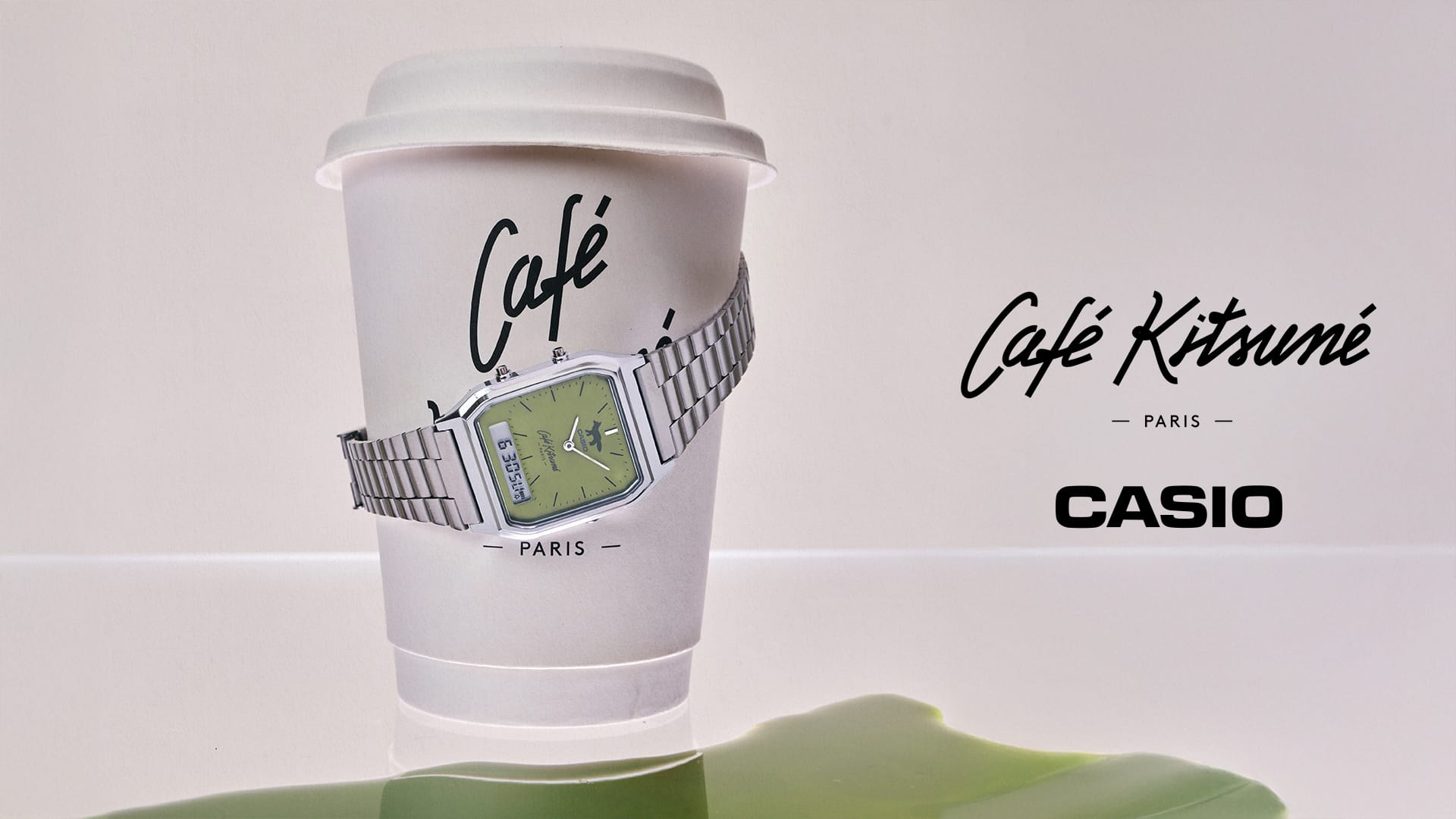 Main visual 3 of CASIO x Café Kitsuné collaboration watch AQ-230ECK-3A wrapped around a paper coffee cup