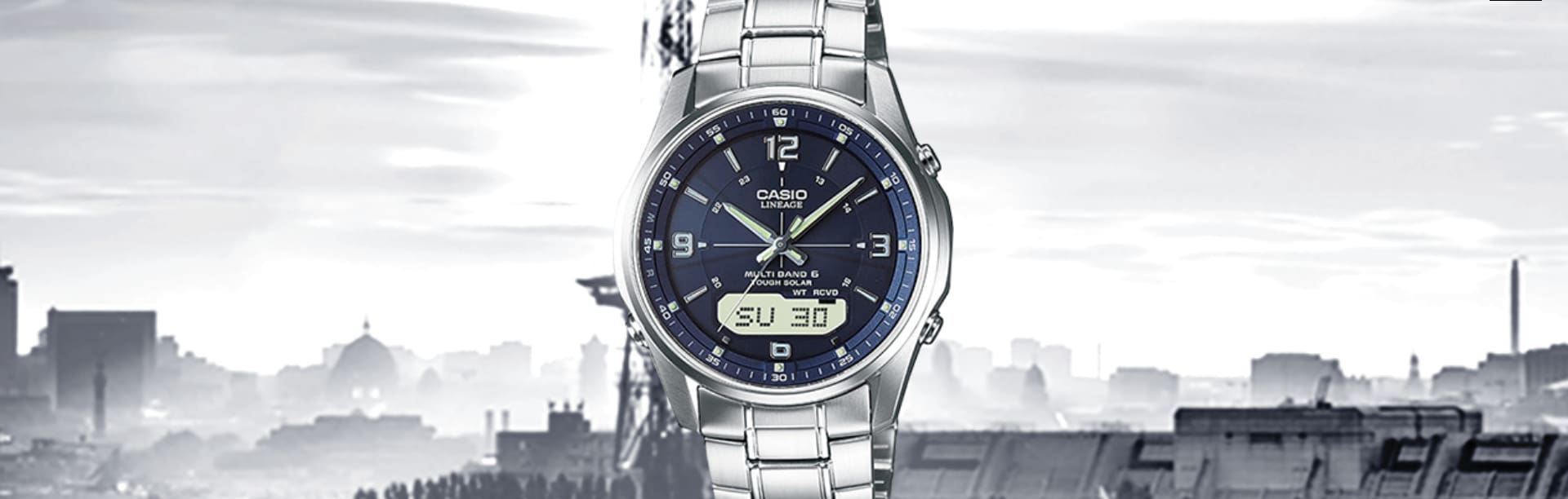 CASIO radio-controlled watch LCW-M100DSE-2A is pictured in front of a city