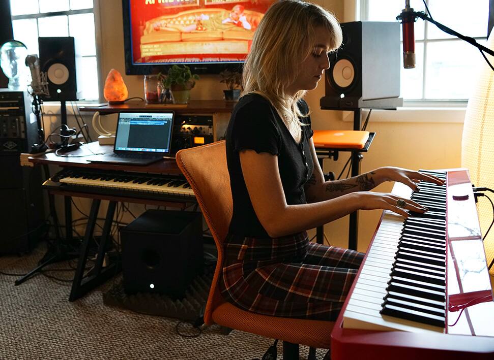 April Rose Gabrielli Playing Piano Side View