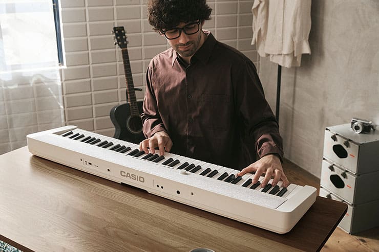 Man playing the Casiotone CT-S1-76WE stage keyboard.