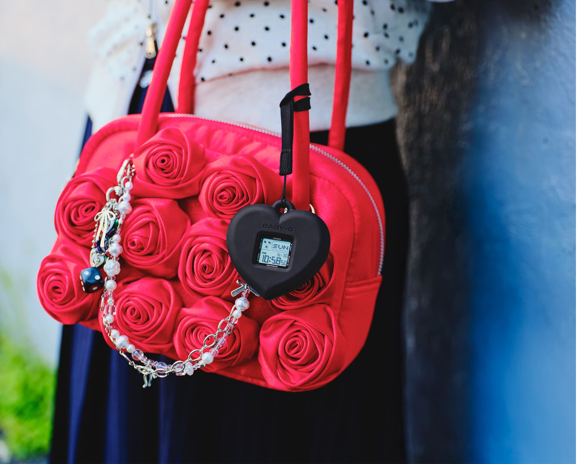 Photo of BGD-10KH-2B attached to a bag as a charm.