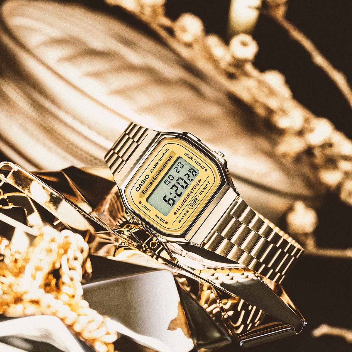 Casio Vintage A168WG-9W amidst gold decorum denoting style