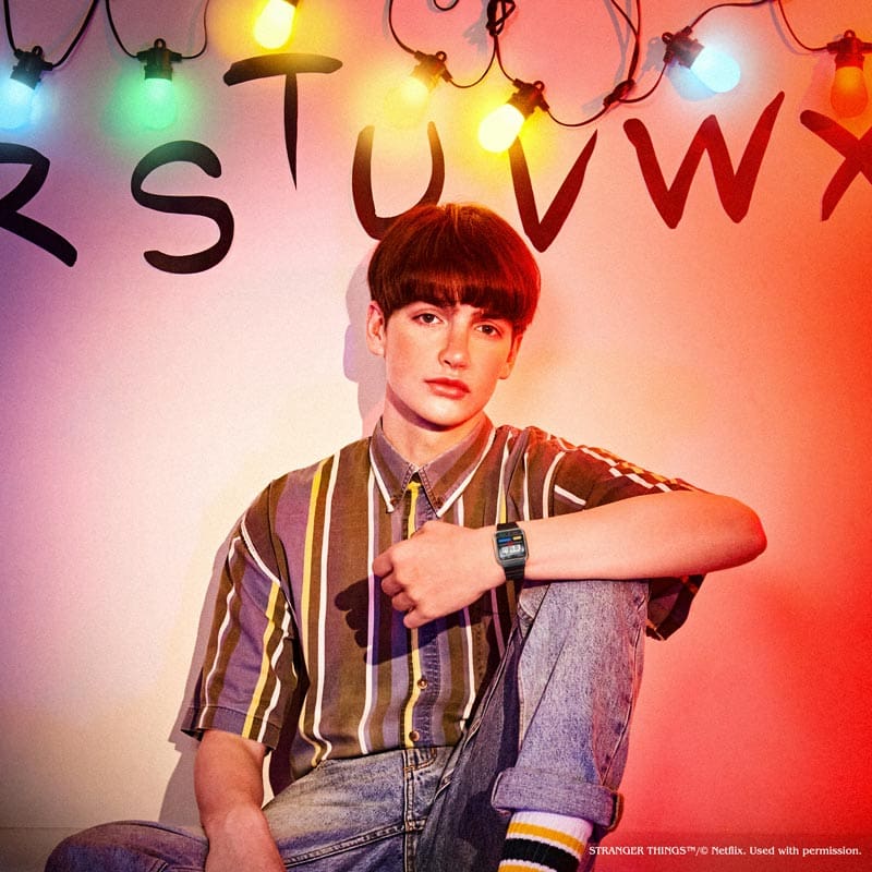 Model dressed like Netflix Stranger Things character with  Casio x Netflix Stranger Things Collaboration digital watch model