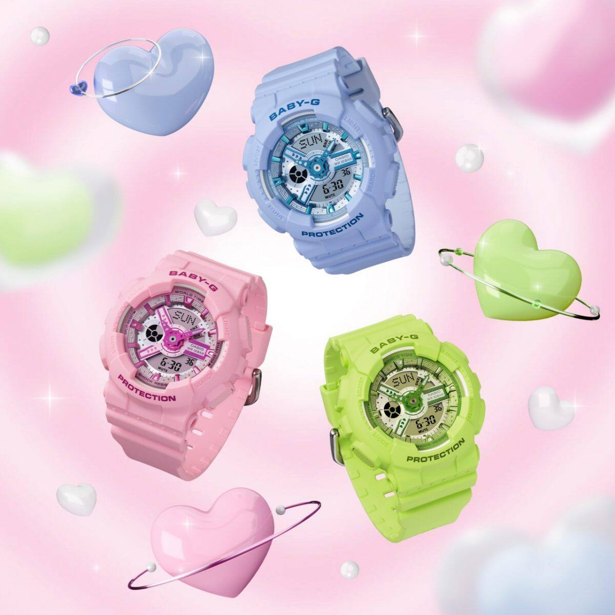 Im Uhrzeigersinn von oben sind drei BABY-G Armbanduhren zu sehen: BA-110YK-2A in Hellblau, BA-110YK-3A in grellem Grün, BA-110YK-4A in Pink