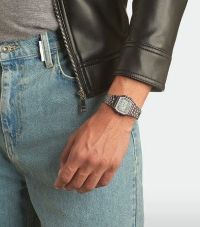 A man wearing a black leather jacket is wearing the A158WETB-1A digital watch on his wrist