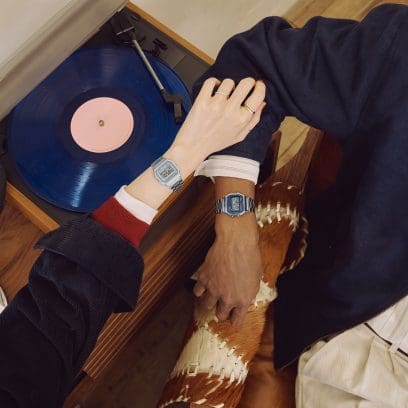 A man is wearing the blue A158WEA-2EF on his wrist and a woman the silver A158WEA-7EF.