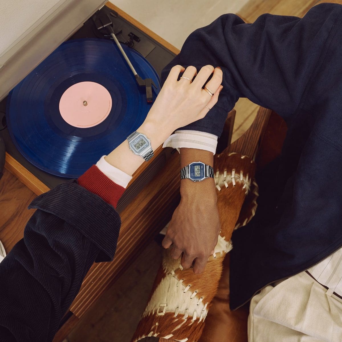 A man is wearing the blue A158WEA-2EF on his wrist and a woman the silver A158WEA-7EF.