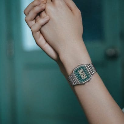 A woman is wearing the A158WEM-3EF on her wrist.