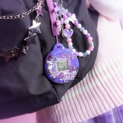 Case of the BGD-10KKM-1 in a purple case attached to a black rucksack