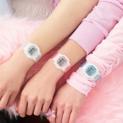 Three color models in this series in white, pink and blue on three wrists each 