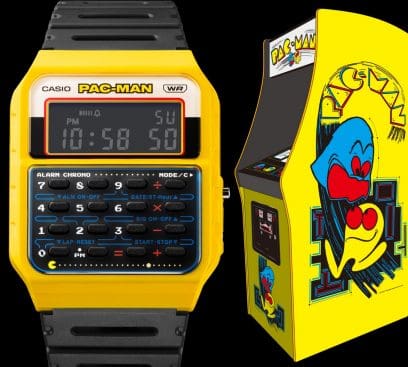The CA-53WPC-1B collaboration watch with yellow case next to a Pacman slot machine