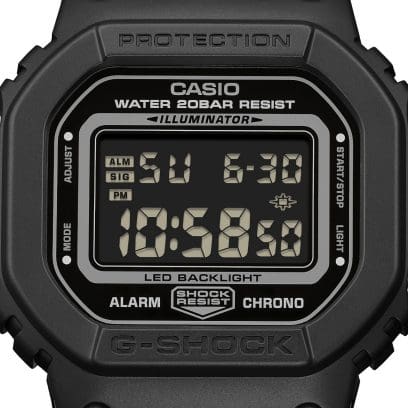Close-up of the digital display of the black G-SHOCK DW-5600MNC-1ER wristwatch with time and date display.