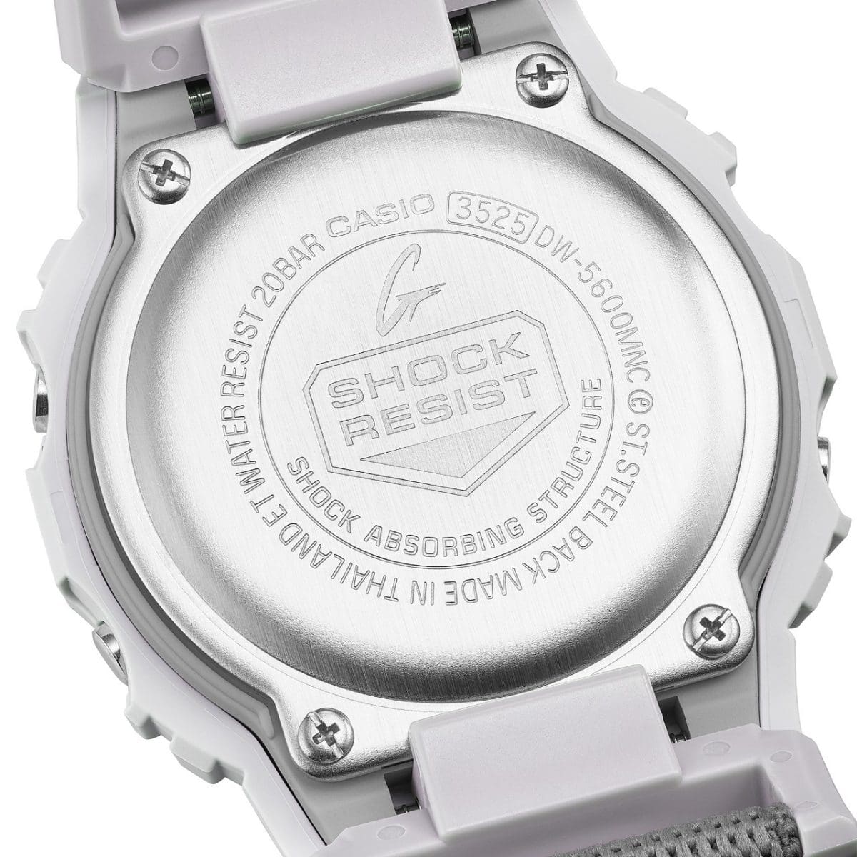 The words SHOCK RESIST are engraved on the back of the G-SHOCK DW-5600MNC-7A8 digital watch.