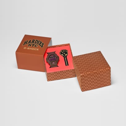 The packaging of the DW-6900HH-5ER features the double-H monogram pattern. The Hardies NYC and G-SHOCK logos are visible on the top.