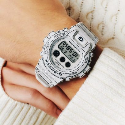 The DW-6900RGM-5ER on the wrist of a person wearing a white knitted sweater