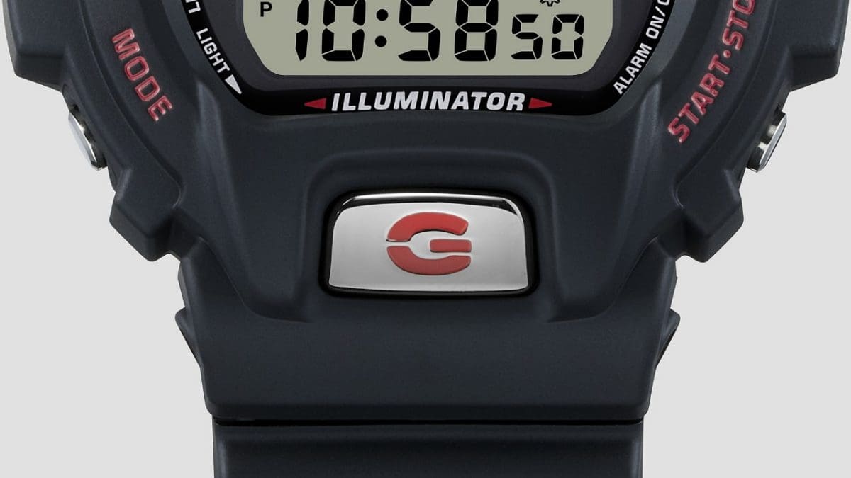 Detailed view of the large front button below the display with G-SHOCK "G" on it.