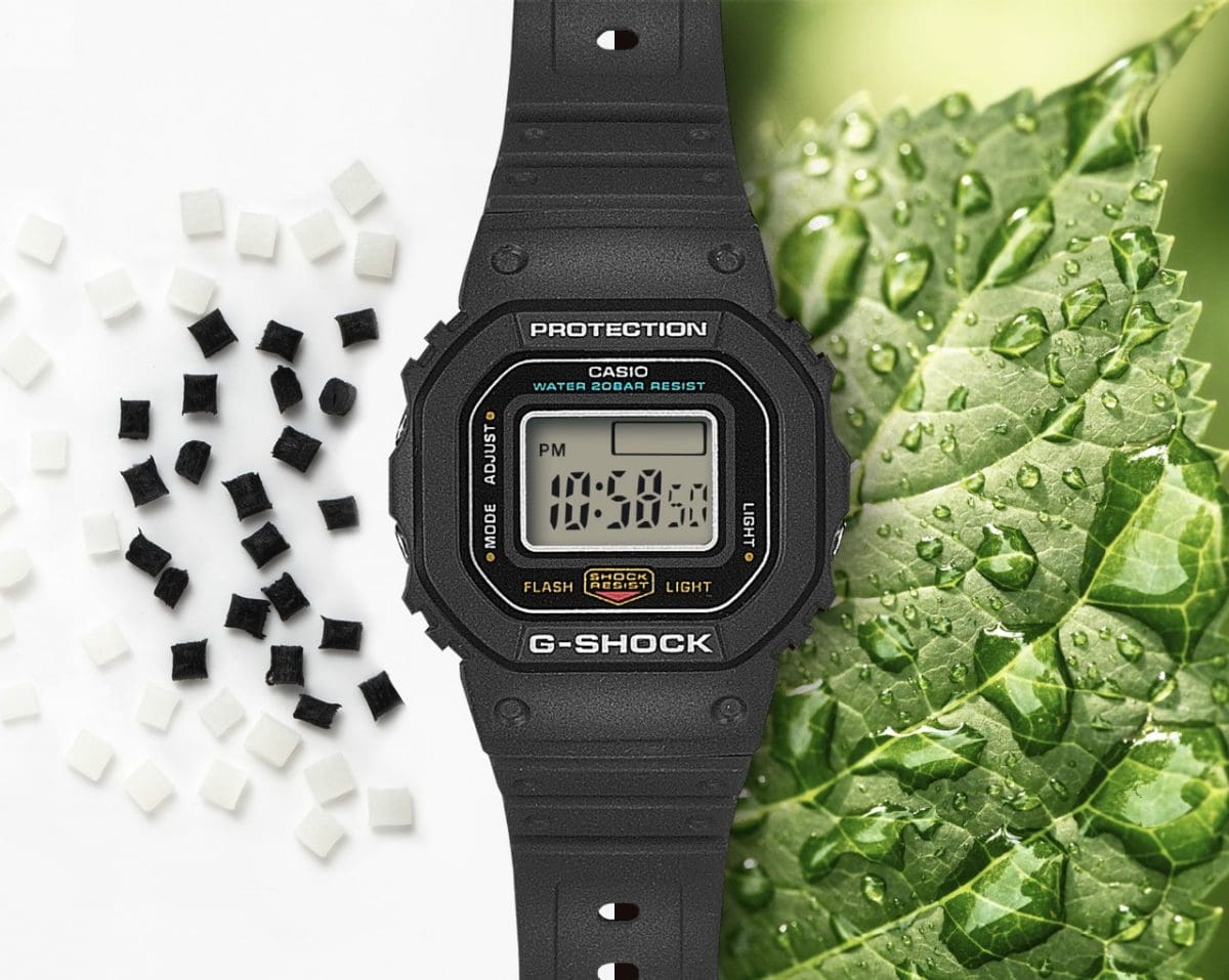 To the right of the DWN-5600-1ER you can see a green leaf with water drops and to the left of it black and white beads of the resin material