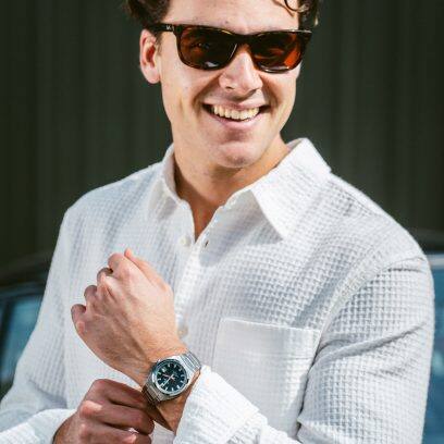 A man with a white shirt and sunglasses wears the EFB-109D-1AV
