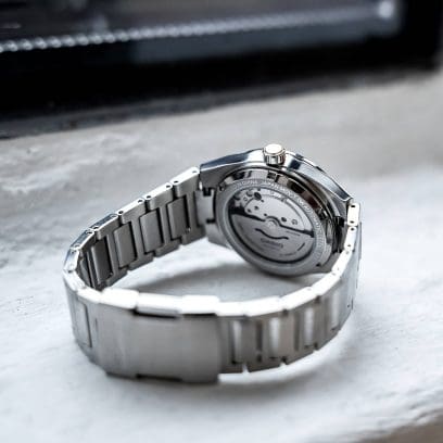 Transparent case back of the EFK-110D-1A, through which the mechanical movement can be seen